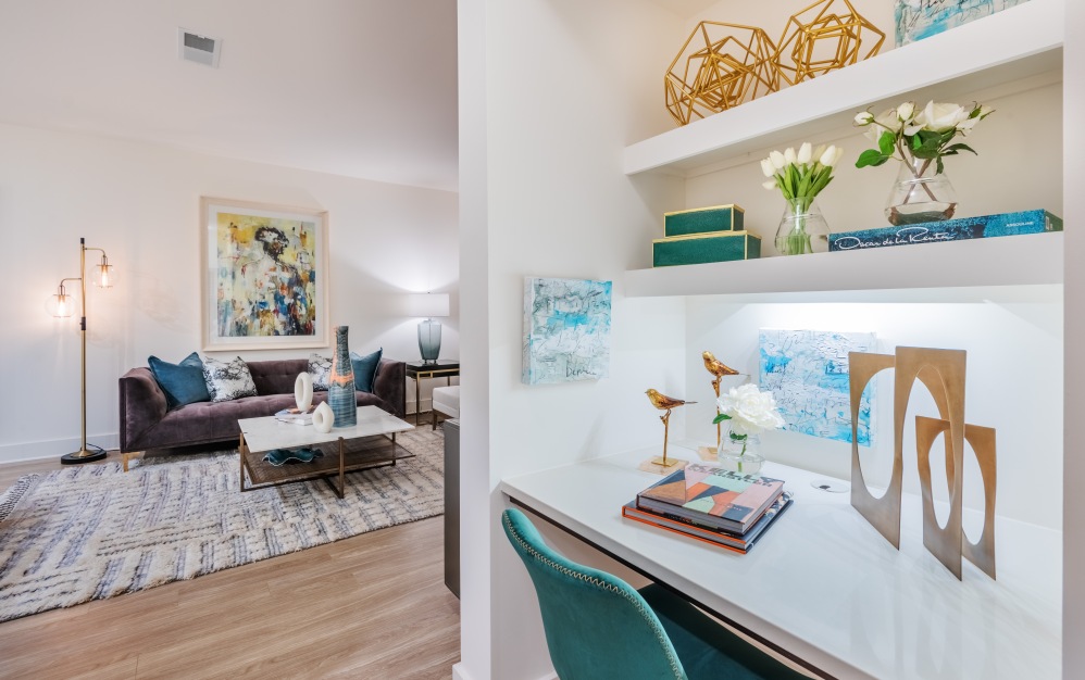 two bedroom apartment built in desk and furnished living room