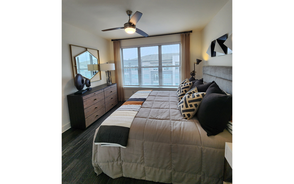 furnished bedroom with ceiling fan